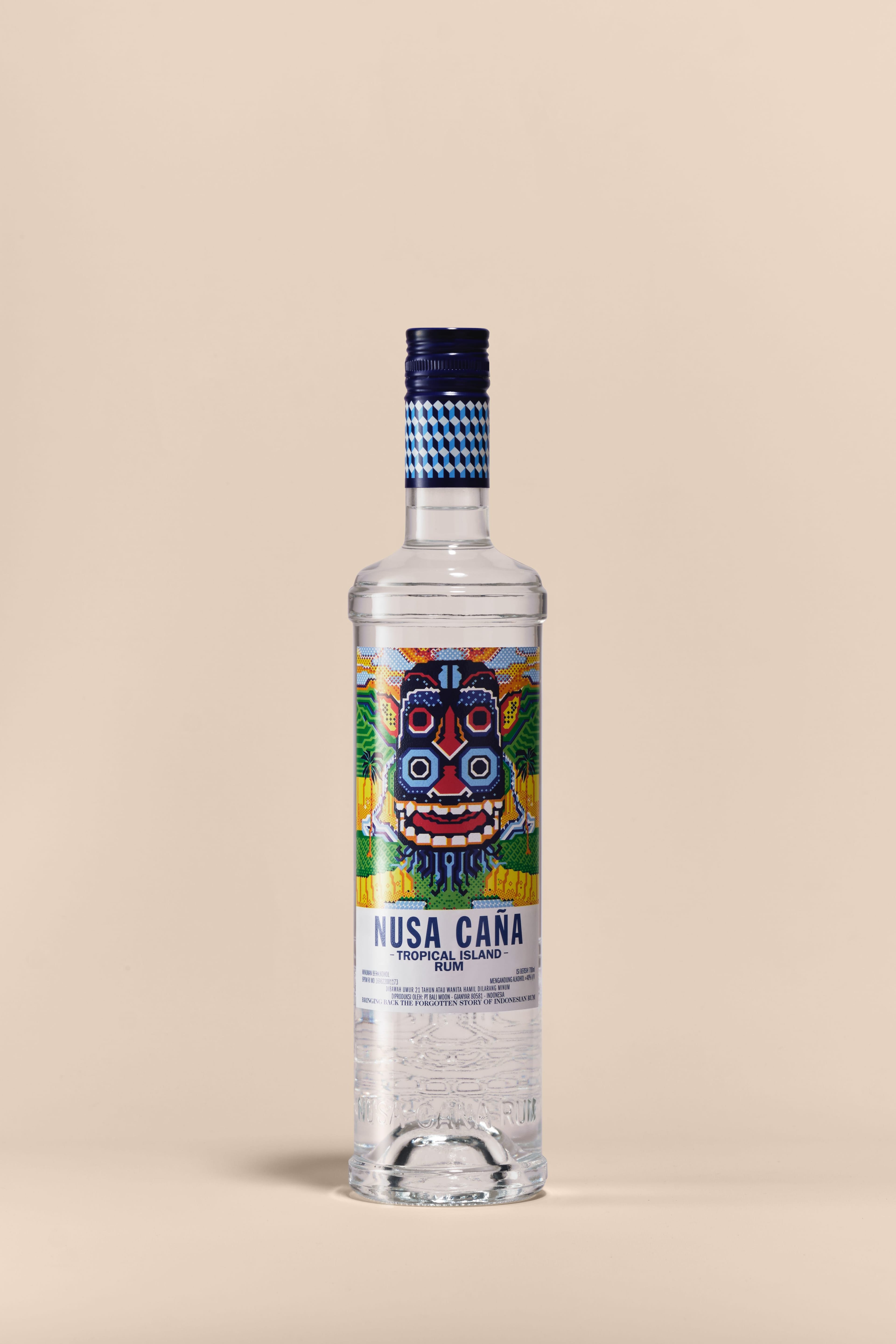 Nusa Caña Tropical Island rum bottle with a beige background.
